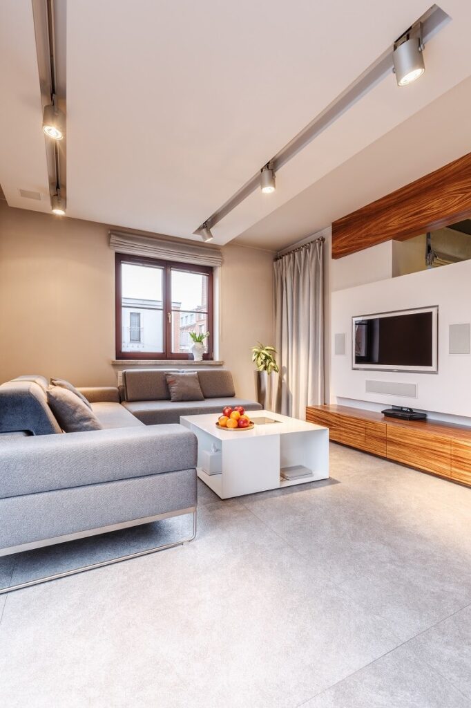 Lounge with a low veneer media unit and wall-mounted TV
