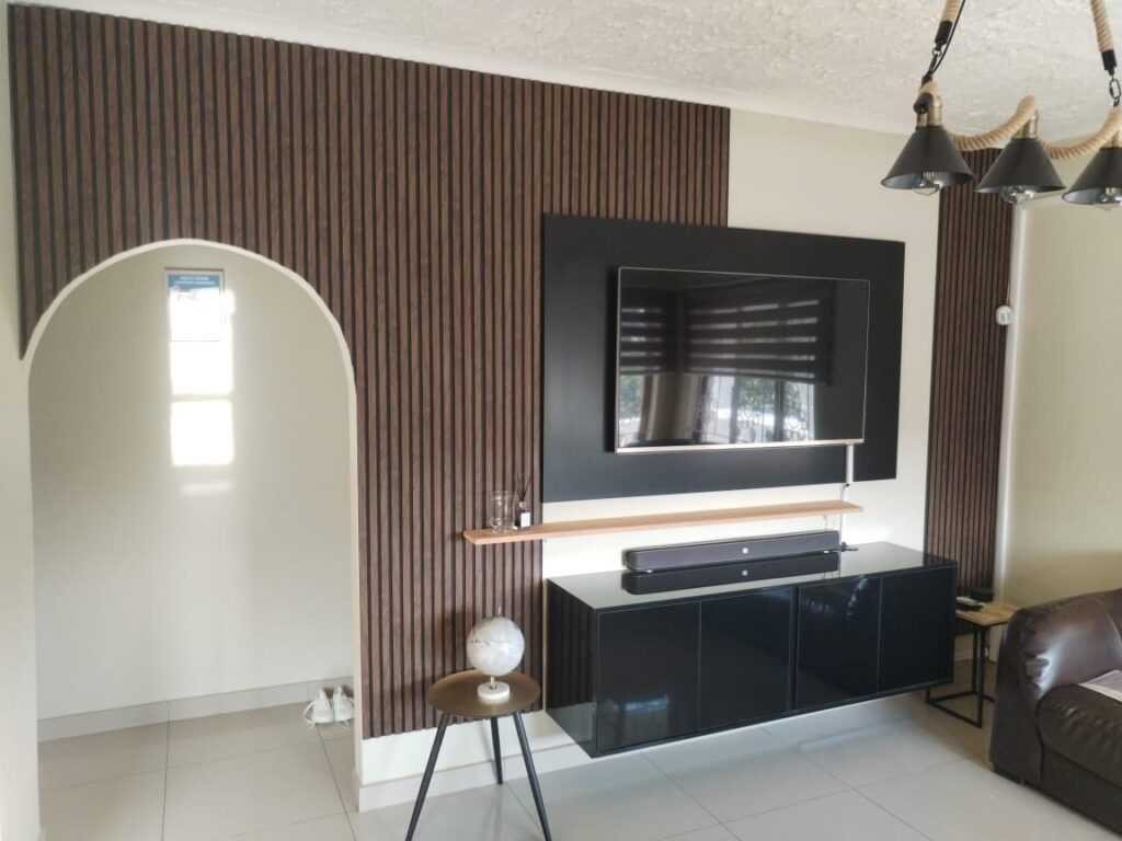 Slatted timber TV feature wall with floating gloss media unit