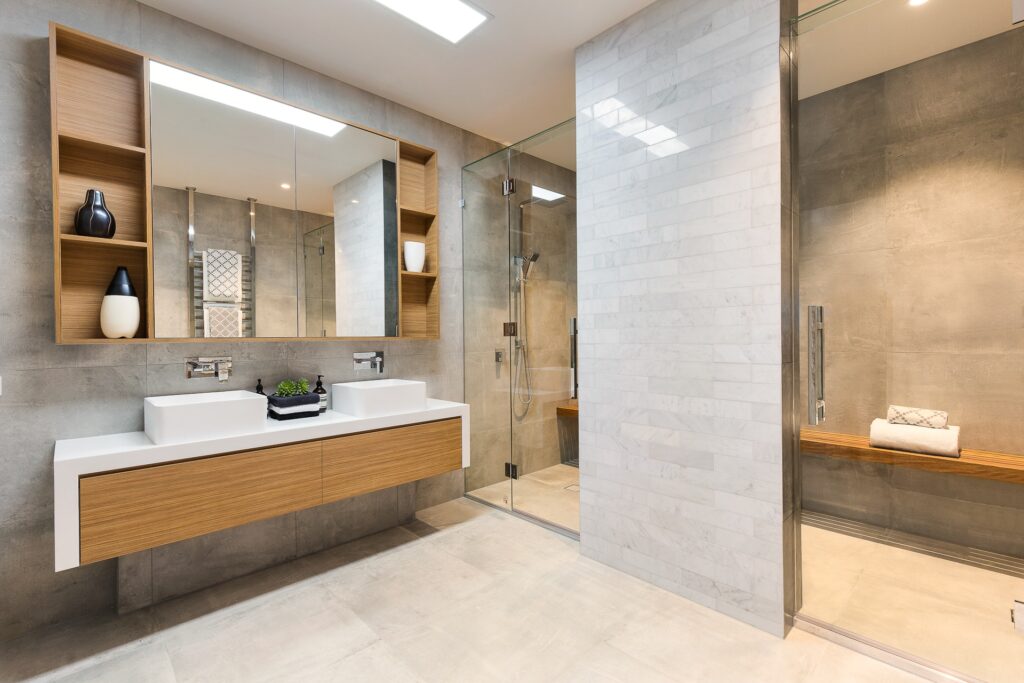 Bathroom with oak vanity, mirror cabinet and frameless glass shower