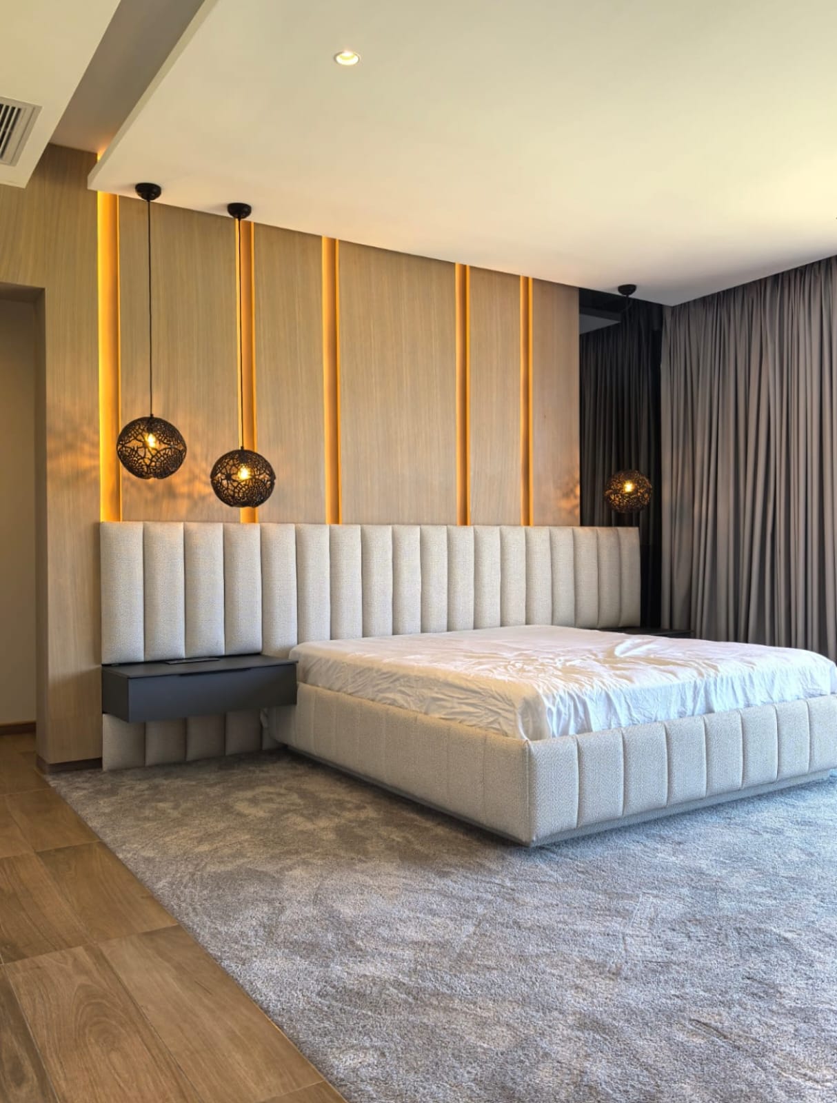 A sanctuary of comfort and elegance—where warm lighting, refined textures, and modern design create the perfect retreat.