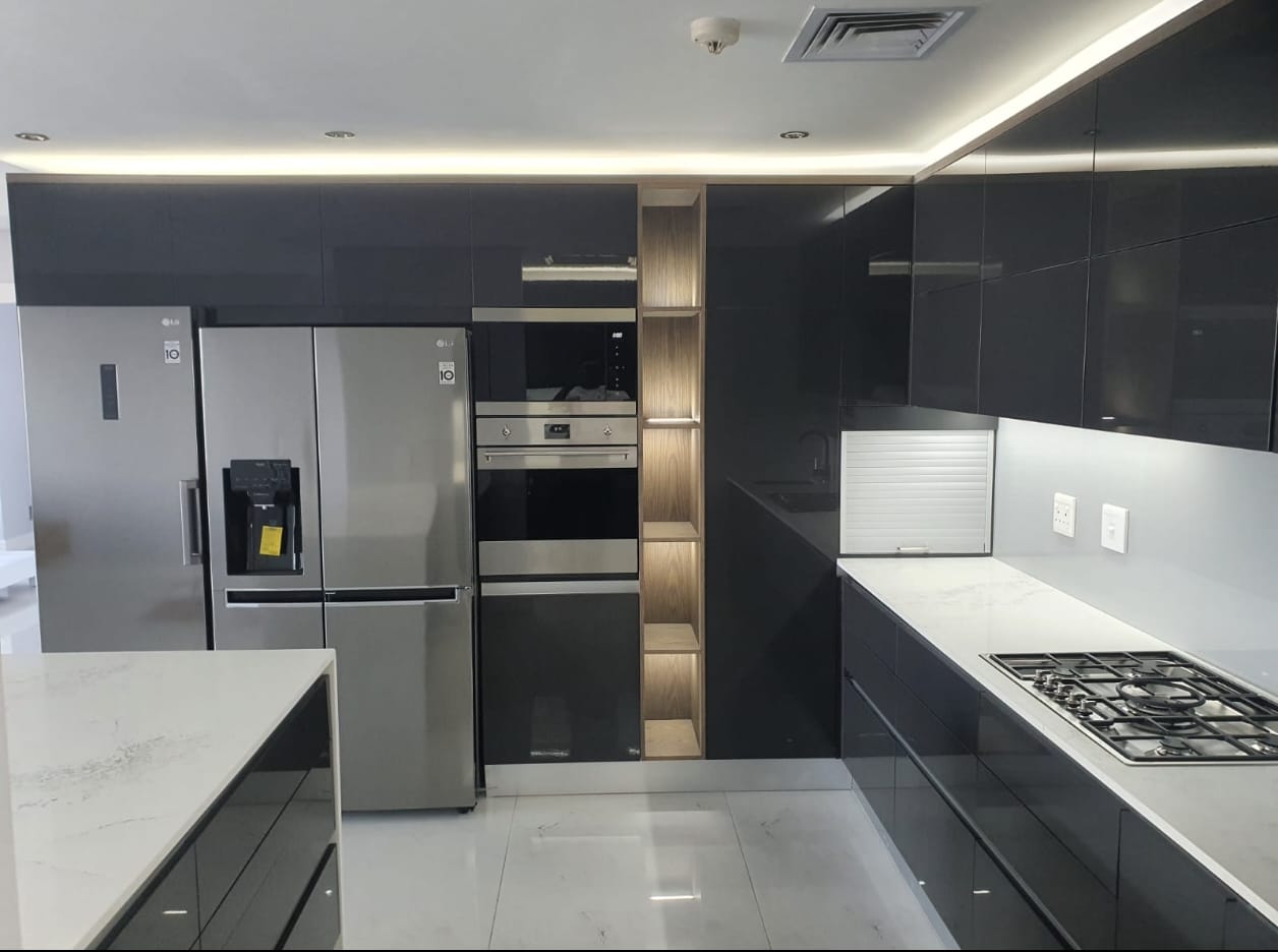 Modern luxury meets effortless functionality—sleek finishes, smart design, and a kitchen made to impress.